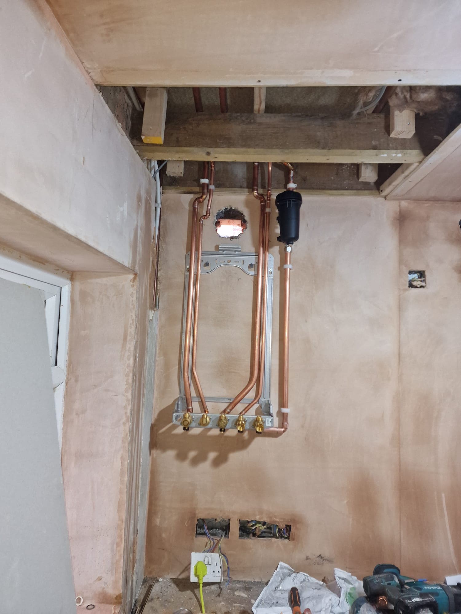 Neat copper pipework and boiler frame fitted ready for new boiler installation